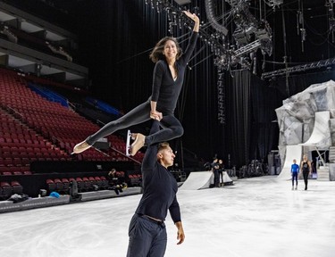 Dmitry Semykin carries Hjordis Lee with one arm during rehearsals for the new Cirque du Soleil ice show Crystal at the Bell Centre in Montreal on Thursday, Dec. 21, 2023.
