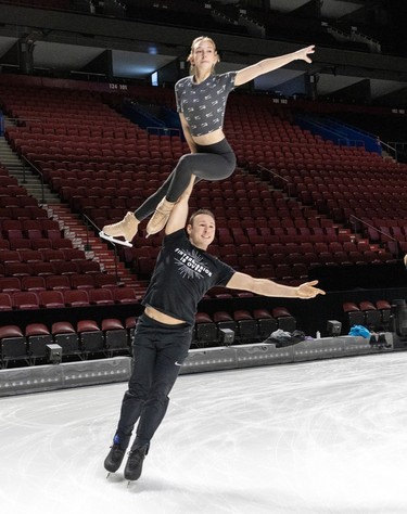 Michael Helgren lifts Shalena Rau over his head during rehearsals for the new Cirque du Soleil ice show Crystal at the Bell Centre in Montreal on Thursday, Dec. 21, 2023.