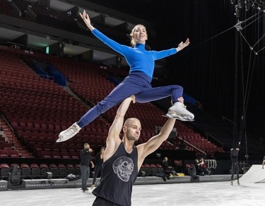 Stuart Widdall skates with Stina Martini over his head during rehearsals for the new Cirque du Soleil ice show Crystal at the Bell Centre in Montreal on Thursday, Dec. 21, 2023.