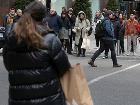 A street scene full of shoppers.