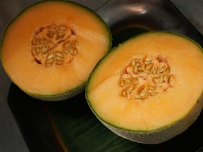 A photo illustration of a cantaloupe cut in half.