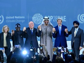 In this handout image supplied by COP28, Group photo with His Excellency Dr. Sultan Al Jaber (C), COP28 President, John Kerry (R2), U.S. special presidential envoy for climate, Xie Zhenhua (L3), Chinese Politician, Ajay Banga (R1), President of the World Bank and Inger Andersen (L1), Executive Director (UNEP) during the Energy Session at Al Waha Theatre during day two of the high-level segment of the UNFCCC COP28 Climate Conference at Expo City Dubai on Saturday, Dec. 2, 2023, in Dubai, United Arab Emirates.
