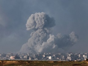 A picture taken from southern Israel near the border with the Gaza Strip on Dec. 6, 2023 shows smoke billowing during Israeli bombardment in Gaza.