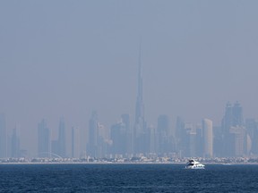 Dubai's skyline including Burj Khalifa, the world's tallest building, is overcast by haze on Dec. 10, 2023.