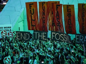 Climate activists attend a protest against fossil fuels during the United Nations Climate Change Conference COP28 in Dubai on Dec. 12, 2023.