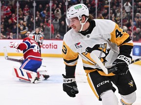 Penguins' Jansen Harkins celebrates after beating Canadiens goalie Sam Montembeault for the winning goal in the twelfth round of a shootout at the Bell Centre Wednesday night.