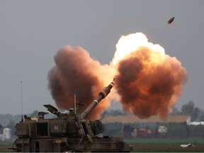 An Israeli army tank shells the Gaza Strip.