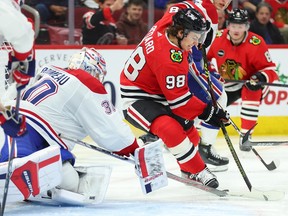 Blackhawks' Connor Bedard's (98) shot on goal is deflected by Canadiens' Cayden Primeau at the United Center on Friday, Dec. 22, 2023, in Chicago.