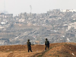Israeli soldiers patrol along the Israel-Gaza border on Dece. 27, 2023.