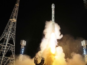 This picture taken on Nov. 21, 2023, and released from North Korea's official Korean Central News Agency (KCNA) on Nov. 22 shows a rocket carrying the reconnaissance satellite 'Malligyong-1' being launched from the Sohae Satellite Launch Site in North Phyongan province.