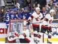 Toronto Maple Leafs right wing Mitchell Marner (16) (third from left) is embraced by teammates including Easton Cowan as they celebrate Marner’s game-tying goal in the third period of preseason NHL hockey against the Ottawa Senators in Toronto on Monday, September 25, 2023. THE CANADIAN PRESS/Cole Burston