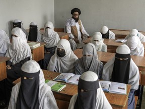 Afghan girls attend a religious school in Kabul, Afghanistan, on Aug. 11, 2022.