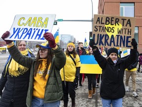 People take part in a rally in support of Ukraine and against the Russian invasion, in Edmonton on Sunday, Feb. 27, 2022.