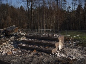 The front step to the McGee family home is pictured among the ruins after the home was destroyed in a wildfire earlier this month in the suburban community of Hammonds Plains, N.S. outside of Halifax on Thursday, June 22, 2023.