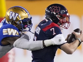 Montreal Alouettes quarterback Cody Fajardo (7) is sacked by Winnipeg Blue Bombers defensive end Willie Jefferson (5) during the first half of football action at the 110th CFL Grey Cup in Hamilton, Ont., on Sunday, November 19, 2023. The CFL will kick off its 2024 schedule with a Grey Cup rematch. The Grey Cup-champion Alouettes will open the campaign visiting the Blue Bombers on June 6, the CFL announced Thursday.