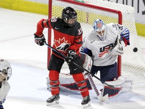 United States goaltender Alex Rigsby makes a save in front of Canada forward Ann-Sophie Bettez at the National Women's Team Rivalry Series hockey in London, Ont., on Feb. 12, 2019.