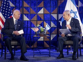 U.S. President Joe Biden, left, meets with Israeli Prime Minister Benjamin Netanyahu, right, to discuss the the war between Israel and Hamas, in Tel Aviv, Israel, on Oct. 18, 2023.