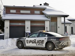 A Laval police car outside a residential building.
