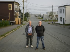 Walter (Wally) Gillespie, left, and Robert (Bobby) Mailman pose in the south end neighbourhood where they grew up in Saint John, N.B., Tuesday, Aug. 18, 2020.