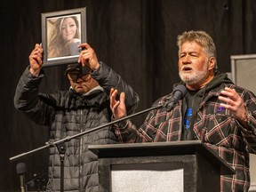 The father of a woman who was fatally shot in October by her former partner is urging senators to pass a federal gun-control bill without delay. Brian Sweeney, right, father of shooting victim Angie Sweeney, speaks on stage during candlelight vigil, in Sault Ste. Marie, Ont., Friday, Oct. 27, 2023.
