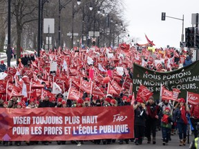 A four-week Quebec teachers strike is stirring concerns for students' education and development. Striking teachers with the FAE union march through the streets to press their contract demands, in Montreal, Tuesday, Dec. 12, 2023.