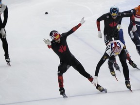 Steven Dubois of Terrebonne earned his first gold of the season to lead a four-medal day for Canada at a short track speedskating World Cup stop in South Korea on Saturday. Dubois, second from left, and Hwang Dae-heon of South Korea cross the finish line during the final of the men's 1,000-meter at the ISU World Cup Short Track Speed Skating Championships in Seoul, South Korea, on Saturday, Dec. 16, 2023.