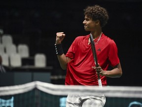 Canada's Gabriel Diallo celebrates his victory against Sweden's Elias Ymer during their Davis Cup group stage tennis match at the Unipol Arena, Bologna, Italy, Thursday, Sept. 14. 2023. Montreal will host a Davis Cup qualification tie between Canada and South Korea in February, Tennis Canada announced Thursday.