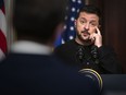 Ukrainian President Volodymyr Zelensky addresses reporters at a news conference with President Biden in Washington on Dec. 12, 2023.