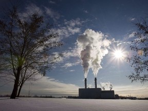 Regulators around the world are increasingly forcing companies to disclose their carbon emissions, along with other key measures like how much financial risk they face from climate change. Smoke pours from the stacks at an energy facility in Toronto on Thursday, Jan. 15, 2009.