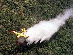 As the smoke lifts on the worst wildfire season ever recorded in Canada, some question whether the country has the fleet of aerial water bombers it needs keep up with longer, more intense seasons fuelled by climate change. A Canadair waterbomber drops a load of water over the Cape Breton Highlands in Nova Scotia on Friday Aug. 10, 2001. THE CANADIAN PRESS