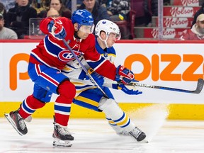 Canadiens defenceman Jayden Struble uses his stick to slow down Sabres' Victor Olofsson during early January game at the Bell Centre.