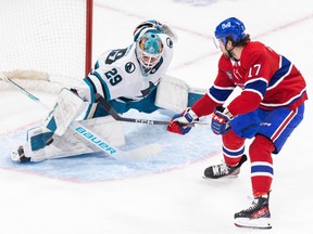 San Jose Sharks goalie Mackenzie Blackwood sticks out his leg to stop the puck in front of Canadiens' Josh Anderson