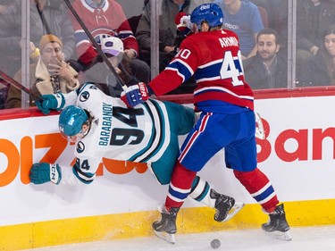 Montreal Canadiens' Joel Armia checks San Jose Sharks' Alexander Barabanov into the boards
