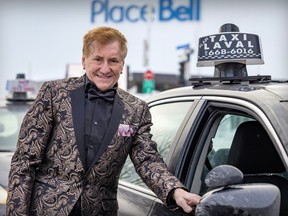 Taxi owner Alain Boudreault with his Alain Taxi Laval dome light in Laval on Jan. 15, 2024.