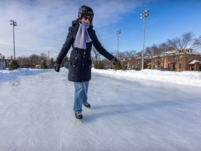 A woman skating on an outdoor rink