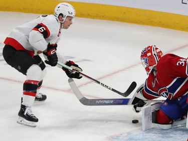 Montreal Canadiens goaltender Jake Allen shops a shot by Ottawa Senators' Jakob Chychrun