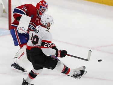 Montreal Canadiens goaltender Jake Allen comes out of his net to shoot the puck away from Ottawa Senators' Claude Giroux