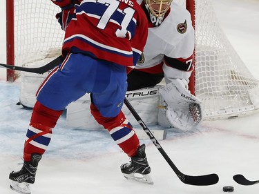 Montreal Canadiens' Jake Evans (71) tries for a shot on Ottawa Senators goaltender Joonas Korpisalo