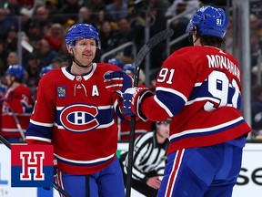 Two Montreal Canadiens players celebrate scoring a goal