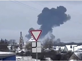 Smoke rises from the scene of a warplane crash in a residential area near Yablonovo, Belgorod region.