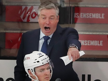 Patrick Roy yells from behind the bench