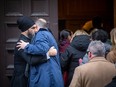 NDP Leader Jagmeet Singh gave a hug to another guest before heading into the service for the late Ed Broadbent.
