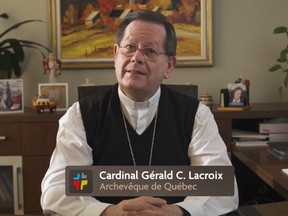 Cardinal Gérald Lacroix sits at an office desk facing a camera