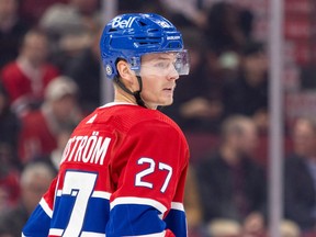 Gustav Lindstrom stands on the ice in a Canadiens jersey