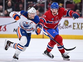 Canadiens' defenceman Arber Xhekaj tries to angle Oilers superstar Connor McDavid out of the play during a game last February.