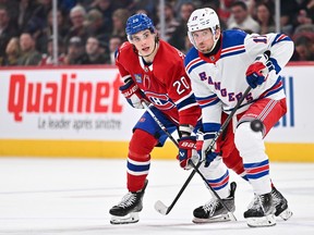 Canadiens' Juraj Slafkovsky (20) and Blake Wheeler (17) of the New York Rangers skate after the puck at the Bell Centre on Saturday, Jan. 6, 2024, in Montreal.