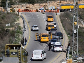 A closed barrier blocks the northern entrance to the occupied West Bank city of Ramallah, after an Israeli civilian was shot dead on January 7, 2024.