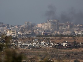Smoke rises over the Gaza Strip as seen from the Israeli side of the border on Jan. 8, 2024 in southern Israel.