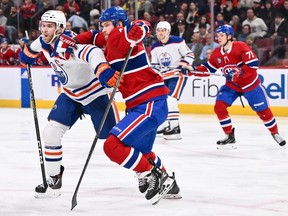 Edmonton Oilers' Connor McDavid, left, and Canadiens' Joel Armia skate against each other at the Bell Centre on Saturday, Jan. 13, 2024, in Montreal.