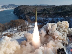 This picture taken on Sunday, Jan. 14, 2024, and released from North Korea's official Korean Central News Agency (KCNA) via KNS on Jan. 15, shows the test-firing of an intermediate-range solid-fuel ballistic missile at an unconfirmed location in North Korea.